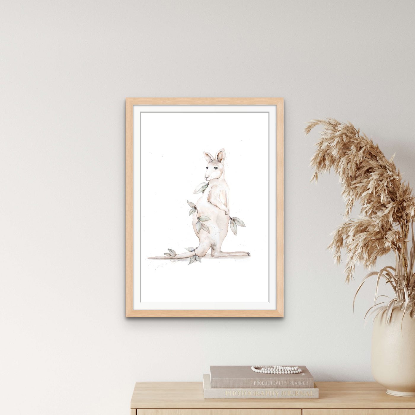 kangaroo fine art print hanging on wall in oak frame