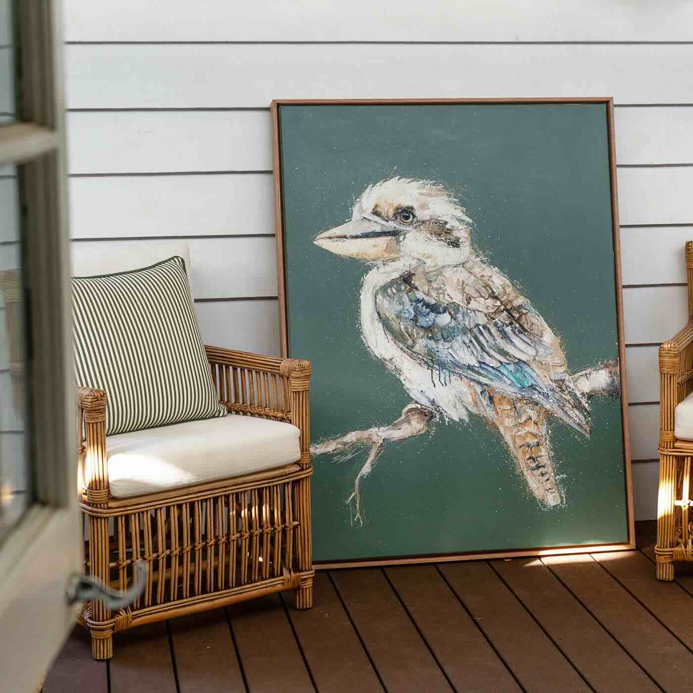 Acrylic painting of a single kookaburra on a soft green background by Stephanie Elizabeth, titled Perched and Patient, framed in oak