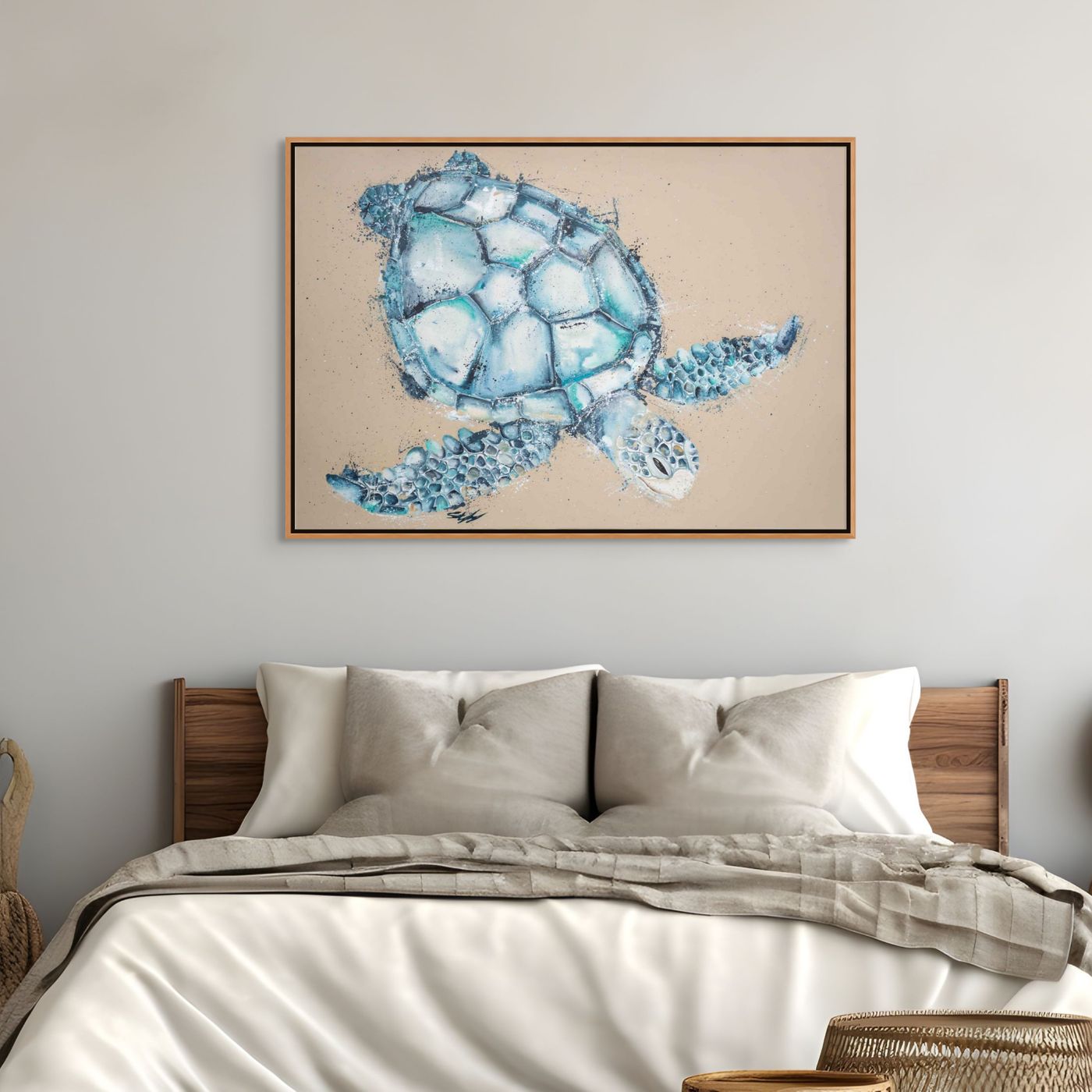 Framed artwork of a blue turtle on a wall above a bed.