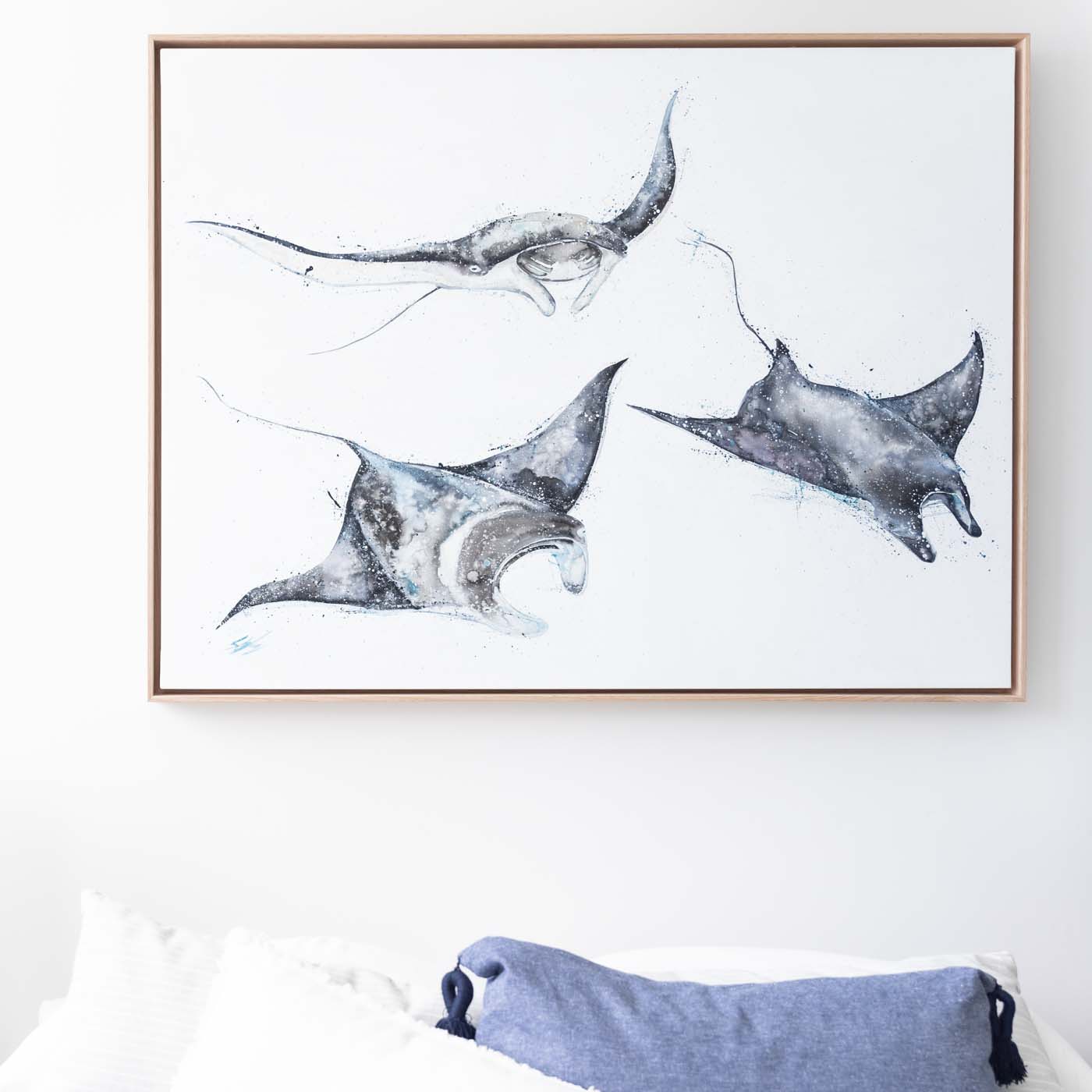 three manta rays painted on canvas framed in oak